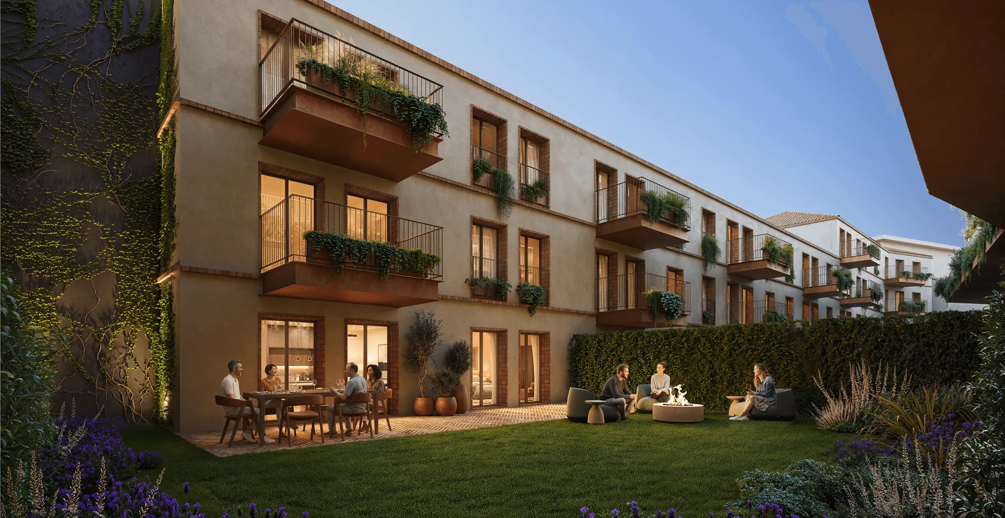Contemporary residential development featuring elegant façades, private balconies with lush greenery, and warm interior lighting. A landscaped courtyard with manicured lawns, flowering plants, and outdoor seating areas creates a welcoming atmosphere, where residents gather and socialize in a peaceful setting at dusk.
